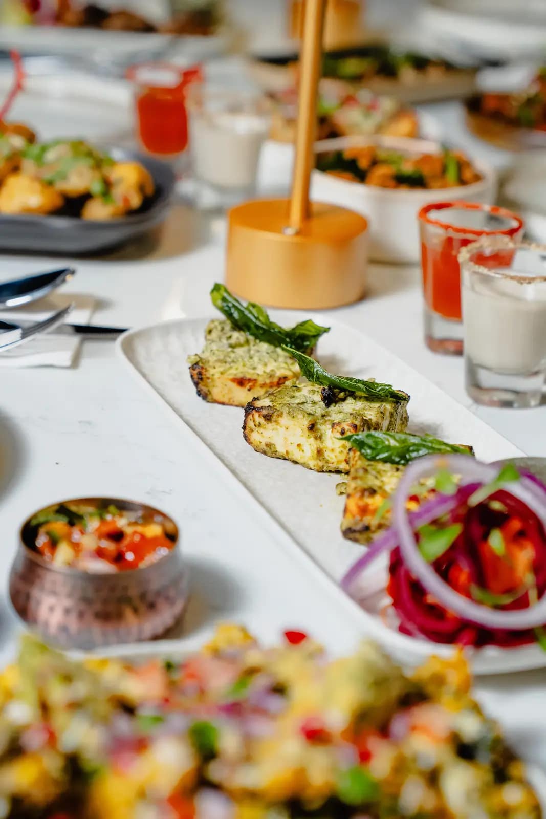 A table spread of modern Indian dishes at Masakali